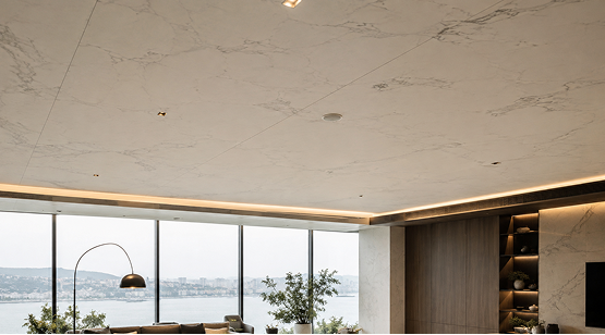Modern interior ceiling clad with thin natural stone panels and cove perimeter LED lighting